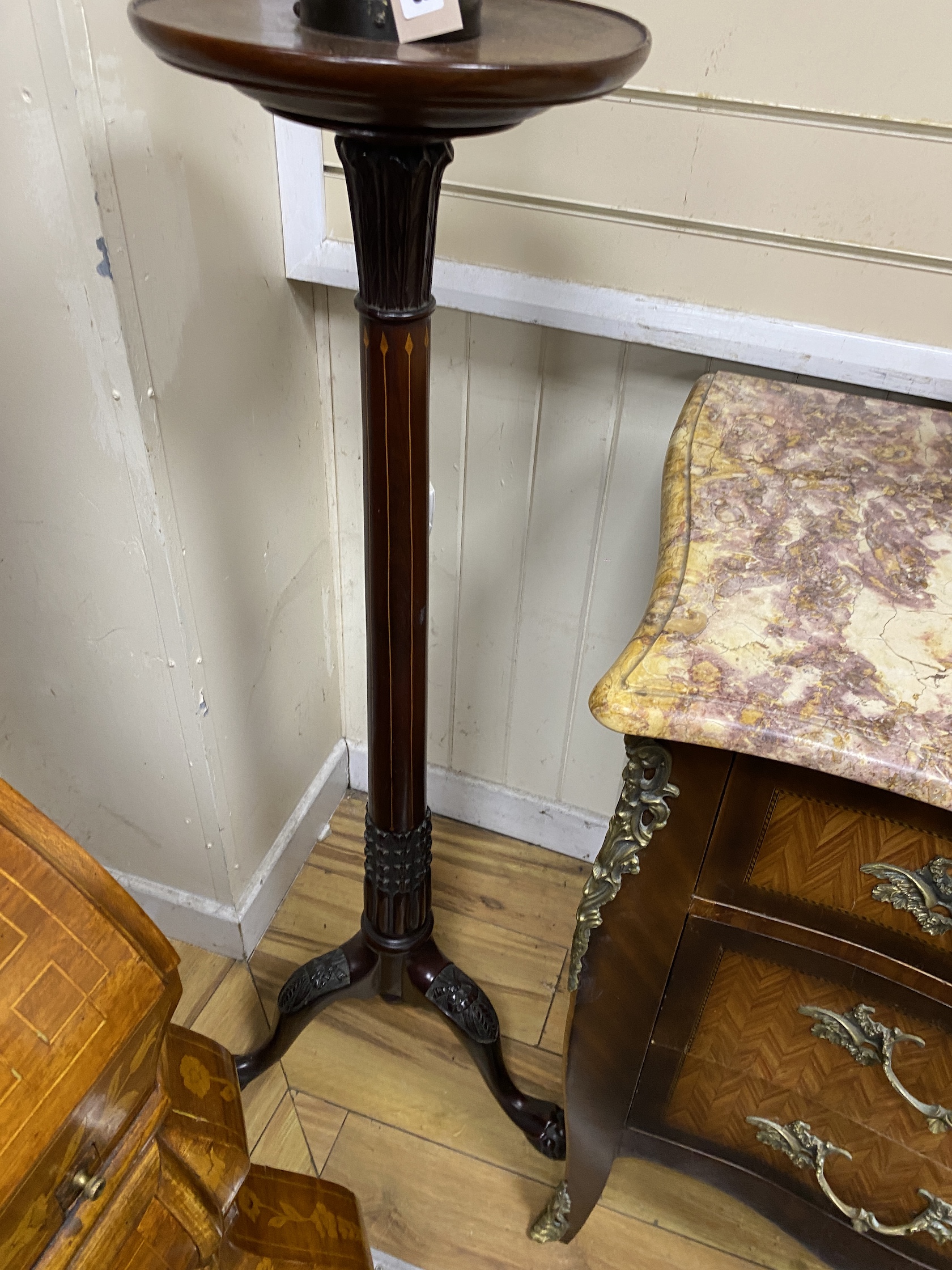 A figural bronze lamp with opaque flambe shade on mahogany torchere, height 210cm